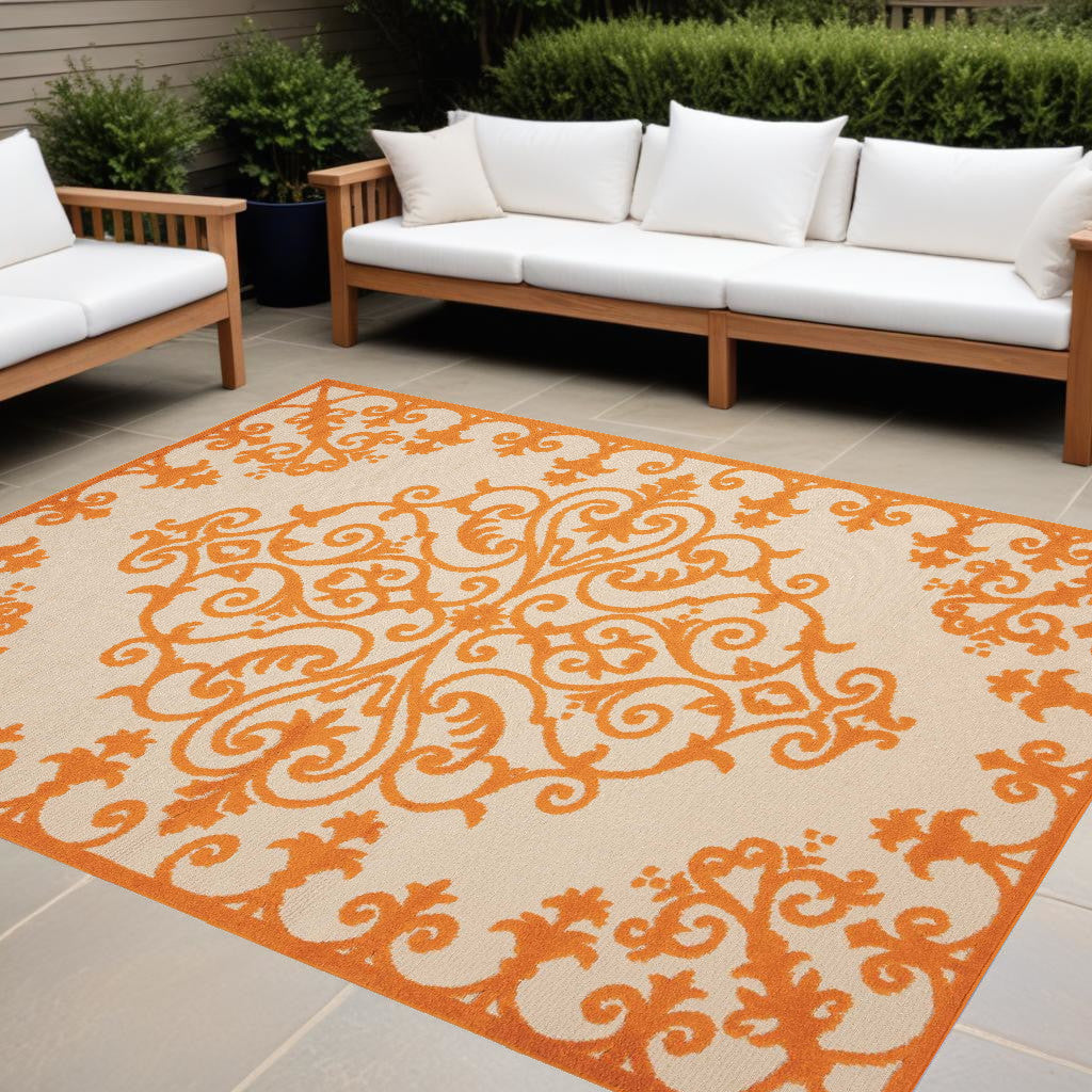 8' X 11' Orange And Ivory Damask Indoor Outdoor Area Rug