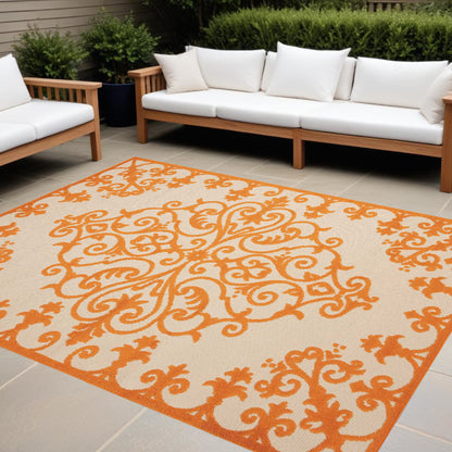 8' X 11' Orange And Ivory Damask Indoor Outdoor Area Rug