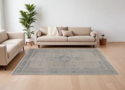 8' X 10' Gray Blue and Taupe Oriental Power Loom Worn Faded Area Rug With Fringe