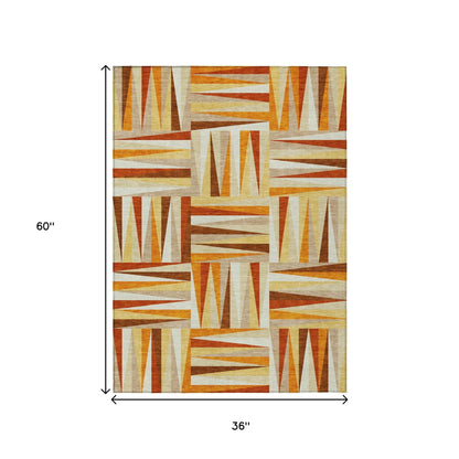 3' X 5' Orange Ivory And Copper Geometric Washable Indoor Outdoor Area Rug