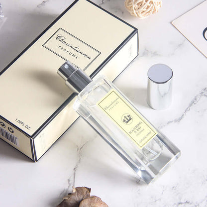Long-lasting light perfume for women with elegant packaging in a stylish bottle on a marble surface.
